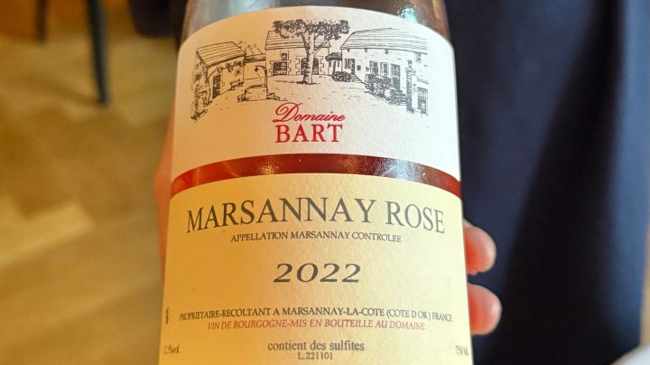 A close-up of a 2022 Marsannay Rosé wine bottle by Domaine Bart, featuring a label with an illustrated vineyard and the text 'Marsannay Rose Appellation Marsannay Controlee'.