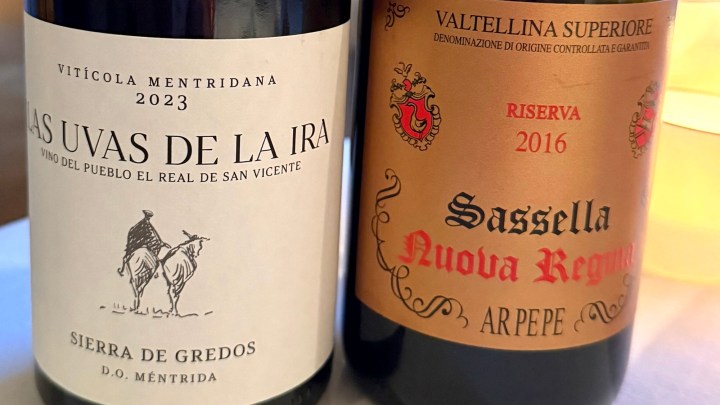 Close-up of two wine bottles: 'Las Uvas de la Ira' from D.O. Méntrida and 'Sassella Nuova Regal' Valtellina Superiore Riserva 2016.