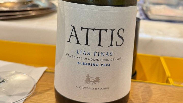 Close-up of an Attis Albariño 2023 wine bottle label, displaying the text and logo.
