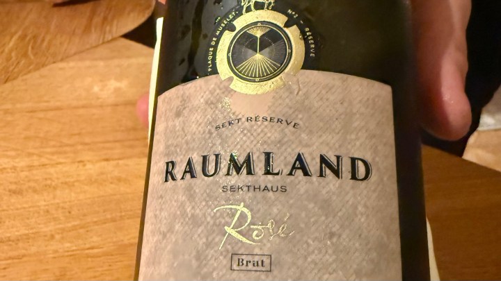 Close-up of a bottle of 2015 Rosé Reserve Sekt from Sekthaus Raumland, showing its label with elegant design and details.