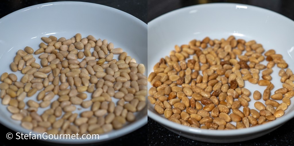 A white bowl containing raw pine nuts on one side and toasted pine nuts on the other, showcasing the difference in color and texture.