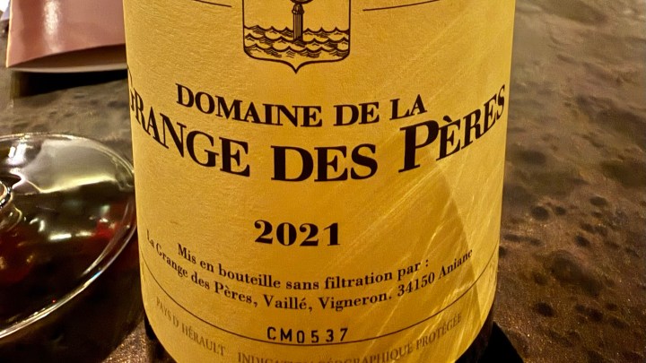 A close-up of the label of a bottle of Domaine de la Grange des Pères wine from 2021, featuring a yellow background with black text.