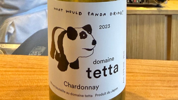 A close-up of a wine bottle label featuring a panda illustration, with text that reads 'What would panda drink?', '2023', 'domaine tetta', and 'Chardonnay'.