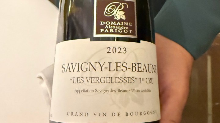 A bottle of 2023 Savigny-les-Beaune 'Les Vergelesses' 1er Cru wine from Domaine Alexandre Parigot, showcasing the label design.