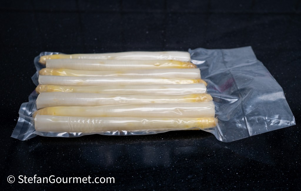 Packaged fish fillets vacuum-sealed in plastic, displaying a light-colored and smooth texture.