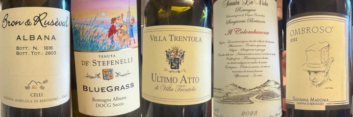 A collection of five wine bottles showcasing their labels, featuring various Italian wines including Albana, Bluegrass, Ultimo Atto, Il Colombarone, and Ombroso.