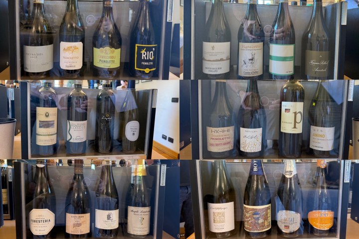 A collection of wine bottles displayed in a organized manner, showcasing various labels and brands from different regions.
