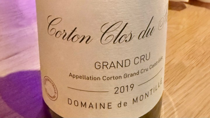 Close-up of a wine bottle label featuring Corton Clos du Montille, 2019 vintage, Grand Cru, Domaine de Montille.